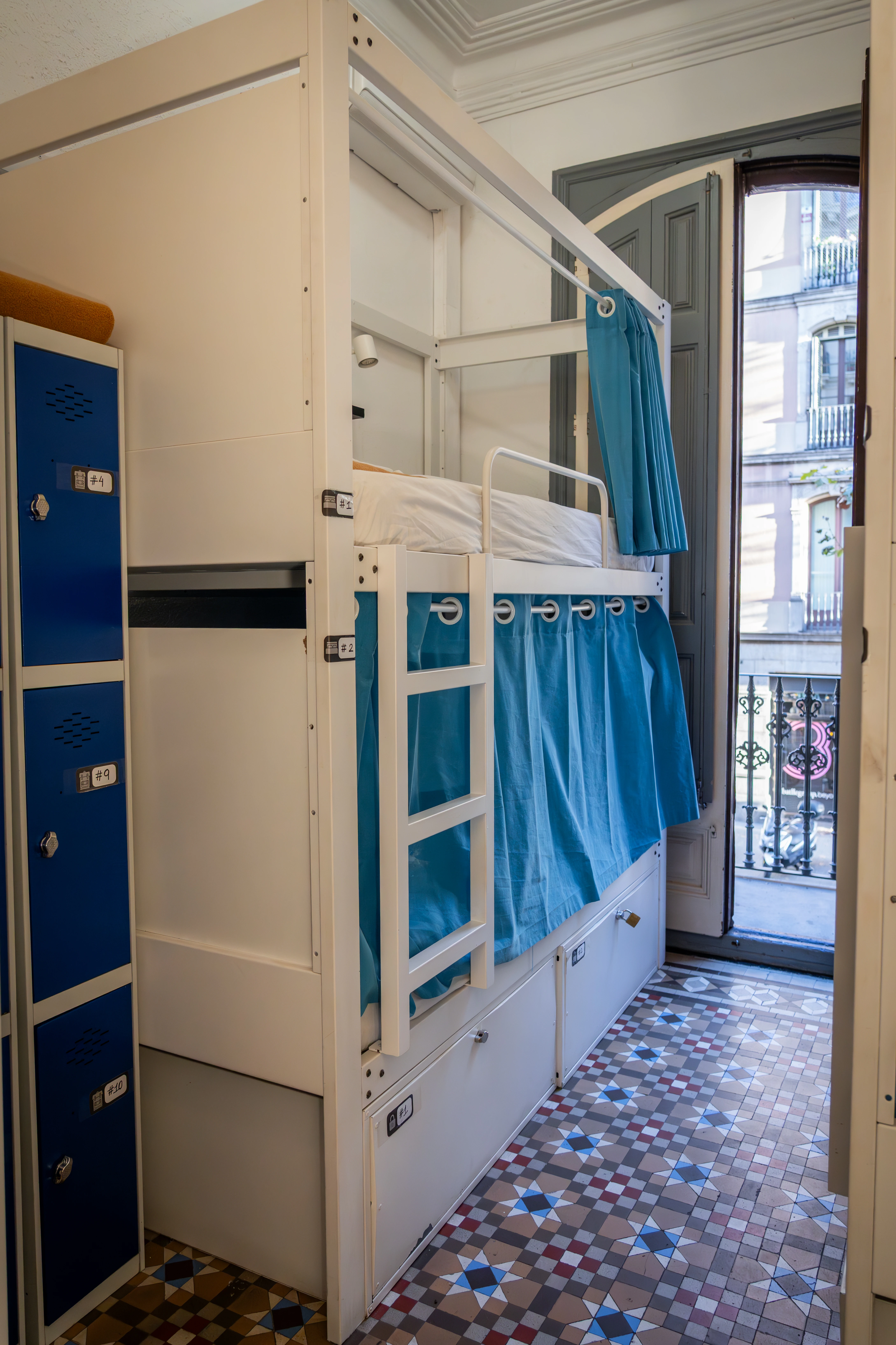 Female 6‑bed dorm in Barcelona, bunks and natural light